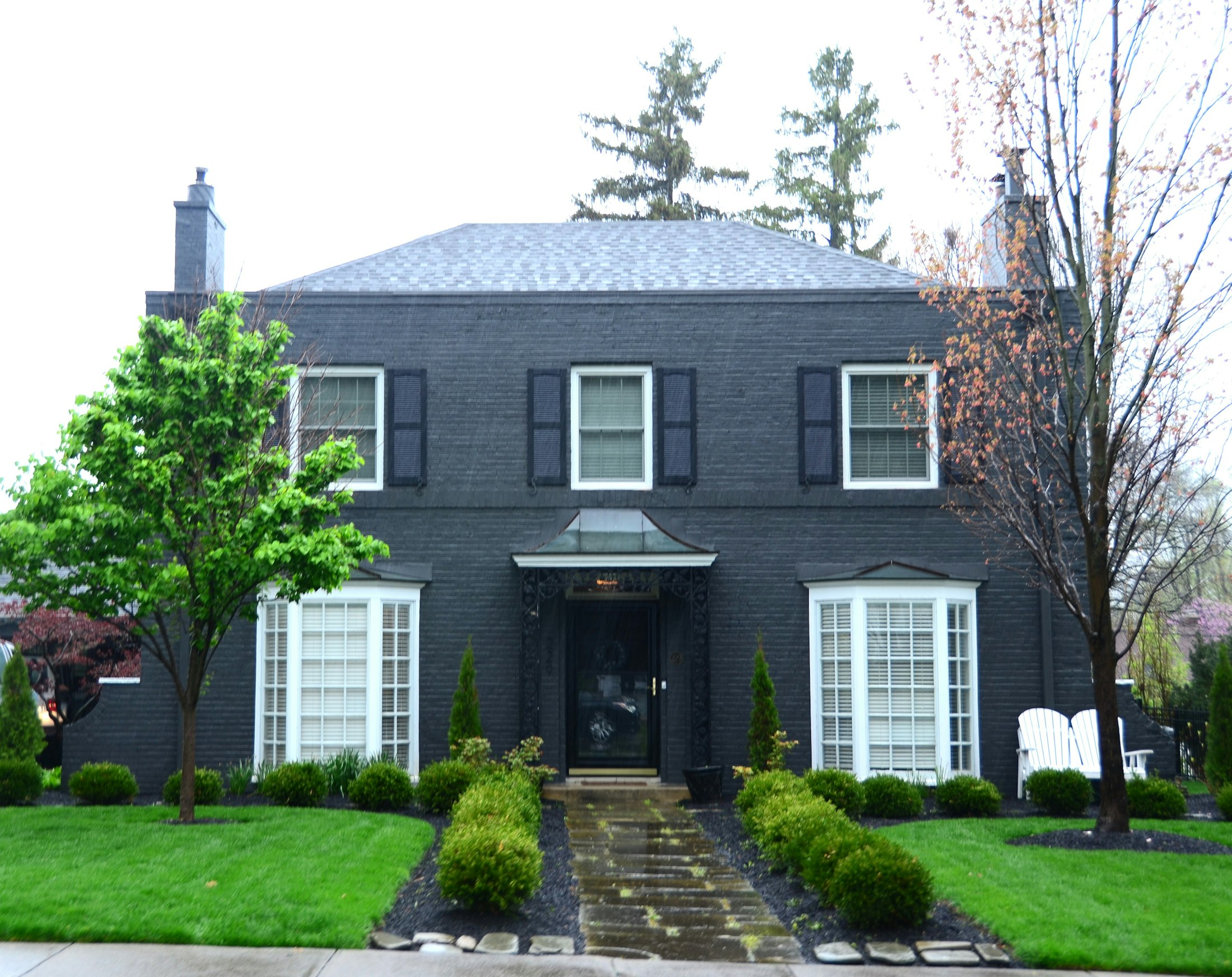 Row of steep gable rooflines against an open sky